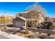 View of the front of a two-story home showcasing desert landscaping, stone accents, and a well-kept yard at 436 Trevinca St, Las Vegas, NV 89138