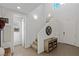 Bright and airy foyer featuring tile floors, a decorative table and a view into other rooms at 436 Trevinca St, Las Vegas, NV 89138