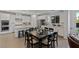 Gourmet kitchen flows into dining area featuring stainless steel appliances and granite countertops at 436 Trevinca St, Las Vegas, NV 89138