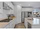 Modern kitchen with granite countertops, stainless steel appliances, and white cabinetry at 436 Trevinca St, Las Vegas, NV 89138