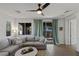 Relaxing living room featuring a ceiling fan and sliding glass doors at 436 Trevinca St, Las Vegas, NV 89138