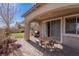 Cozy outdoor patio features brick pavers, a dining set, and access to a grassy yard at 436 Trevinca St, Las Vegas, NV 89138