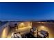 Nighttime rooftop deck showcases city skyline views, ambient lighting, and cozy seating at 436 Trevinca St, Las Vegas, NV 89138