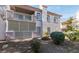 Exterior condo view featuring upper balcony, desert landscaping and stucco facade at 4555 E Sahara Ave # 132, Las Vegas, NV 89104