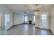 Bright living room features tile floors, a fireplace, modern lighting, and natural light from the windows at 4555 E Sahara Ave # 132, Las Vegas, NV 89104