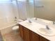 Bathroom featuring a double sink vanity and a shower-tub combination at 4905 Morning Falls Ave, Las Vegas, NV 89131