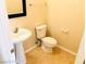 Half-bathroom featuring a pedestal sink and tile floors at 4905 Morning Falls Ave, Las Vegas, NV 89131