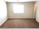 Bedroom with natural light and brown carpet at 4905 Morning Falls Ave, Las Vegas, NV 89131