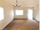 Living room featuring neutral walls and a chandelier at 4905 Morning Falls Ave, Las Vegas, NV 89131