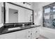 Stylish bathroom featuring double vanity, custom tile, a bathtub, and a shower at 5155 W Tropicana Ave # 1052, Las Vegas, NV 89103