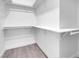 Walk-in closet with white walls and shelves, providing ample storage space at 5155 W Tropicana Ave # 1052, Las Vegas, NV 89103