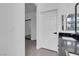 Hallway between bathroom and bedroom showcasing closet with decorative accent wall at 5155 W Tropicana Ave # 1052, Las Vegas, NV 89103