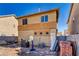 View of the home's backyard, featuring a basketball hoop, brick pile, and ample space at 5179 Floralita St, Las Vegas, NV 89122