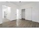 Bedroom featuring wood-look vinyl floors and ample closet space at 5225 W Reno Ave # 105, Las Vegas, NV 89118