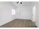 Spacious bedroom with a window, neutral walls, and light wood floors at 5225 W Reno Ave # 105, Las Vegas, NV 89118