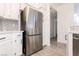 Kitchen featuring stainless steel refrigerator, subway tile backsplash, white cabinetry and bright finishings at 5225 W Reno Ave # 105, Las Vegas, NV 89118