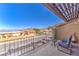 Enjoy lake views from this charming balcony with seating, ideal for relaxation and outdoor enjoyment at 536 Greenbriar Pl, Boulder City, NV 89005