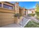 Inviting entry with steps leading to front door, a two-car garage, and desert landscaping at 536 Greenbriar Pl, Boulder City, NV 89005