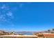 Expansive lake view from rooftop shows serene waters, distant mountains, and nearby palms at 536 Greenbriar Pl, Boulder City, NV 89005