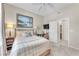 Comfortable bedroom featuring neutral walls, soft carpet, and access to an ensuite bathroom at 5868 Revital Ct, Las Vegas, NV 89131