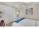 Neutral toned bedroom with a ceiling fan and large closet at 5868 Revital Ct, Las Vegas, NV 89131