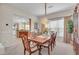 Formal dining room featuring a large wooden table, elegant chairs, and decorative accents at 5868 Revital Ct, Las Vegas, NV 89131