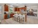 Well-lit kitchen features granite countertops, stainless steel appliances, and a breakfast bar with counter seating at 5868 Revital Ct, Las Vegas, NV 89131