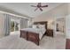 Bright main bedroom features a decorative ceiling fan and a private balcony entrance at 5868 Revital Ct, Las Vegas, NV 89131