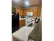 Traditional kitchen featuring wood cabinets, white appliances, tile countertops and tiled backsplash at 5875 Rainbow Bridge Dr, Las Vegas, NV 89142