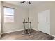 Neutral bedroom with exercise equipment and wood-look flooring at 6035 Eganridge Ct, North Las Vegas, NV 89081