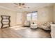 Inviting living room with hardwood floors, ceiling fan, and neutral paint scheme at 6035 Eganridge Ct, North Las Vegas, NV 89081