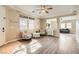 Bright living room featuring stylish decor, hardwood floors, and large windows for natural light at 6035 Eganridge Ct, North Las Vegas, NV 89081