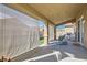 View of the covered patio with sunshades, furniture, and a sink at 6035 Eganridge Ct, North Las Vegas, NV 89081