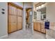 A bathroom with dual vanities and additional linen storage cabinets at 65 Luce Del Sole # 1, Henderson, NV 89011