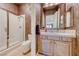 A cozy bathroom with a glass enclosed shower at 65 Luce Del Sole # 1, Henderson, NV 89011