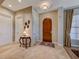 Stylish entryway boasting a decorative wooden door, tile floors, and neutral decor at 65 Luce Del Sole # 1, Henderson, NV 89011