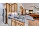 Bright kitchen area featuring stainless steel appliances, granite counters, and an open layout at 65 Luce Del Sole # 1, Henderson, NV 89011