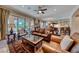 Inviting living room with hardwood floors, a fireplace, and large sliding glass doors leading to the outside at 65 Luce Del Sole # 1, Henderson, NV 89011