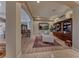 Inviting living room featuring armchairs, hardwood floors, and a built in bookcase at 65 Luce Del Sole # 1, Henderson, NV 89011