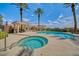 Luxury pool and hot tub with nearby lounge areas and desert landscaping at 65 Luce Del Sole # 1, Henderson, NV 89011