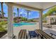 Relaxing pool area with covered seating, sun loungers, and lush landscaping at 65 Luce Del Sole # 1, Henderson, NV 89011