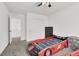 Whimsical ' bedroom featuring race car beds, cozy carpet and a bright window at 6618 Palm Branch St, North Las Vegas, NV 89086