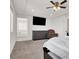 Well-lit bedroom boasts a tray ceiling, ceiling fan and neutral wall color at 6618 Palm Branch St, North Las Vegas, NV 89086