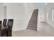 Bright, airy foyer features a staircase leading to the upper level with high ceilings and tile floors at 6618 Palm Branch St, North Las Vegas, NV 89086