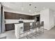 Modern kitchen with stainless steel appliances, a large island, and stylish pendant lighting at 6618 Palm Branch St, North Las Vegas, NV 89086