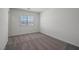 Neutral bedroom with plush carpets, a bright window, and a closet at 6773 Violet Cascade Ave, Las Vegas, NV 89156