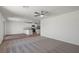 Open-concept living room and kitchen with a ceiling fan at 6773 Violet Cascade Ave, Las Vegas, NV 89156