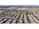 Expansive aerial view showcasing the vastness of the residential neighborhood within a cityscape backdrop at 6832 Upland Heights Ave, Las Vegas, NV 89142