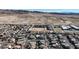 Elevated aerial view captures the street layout, housing density, and nearby desert landscape at 6832 Upland Heights Ave, Las Vegas, NV 89142