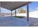 Back patio featuring concrete slab, shade covering and pillars at 6832 Upland Heights Ave, Las Vegas, NV 89142